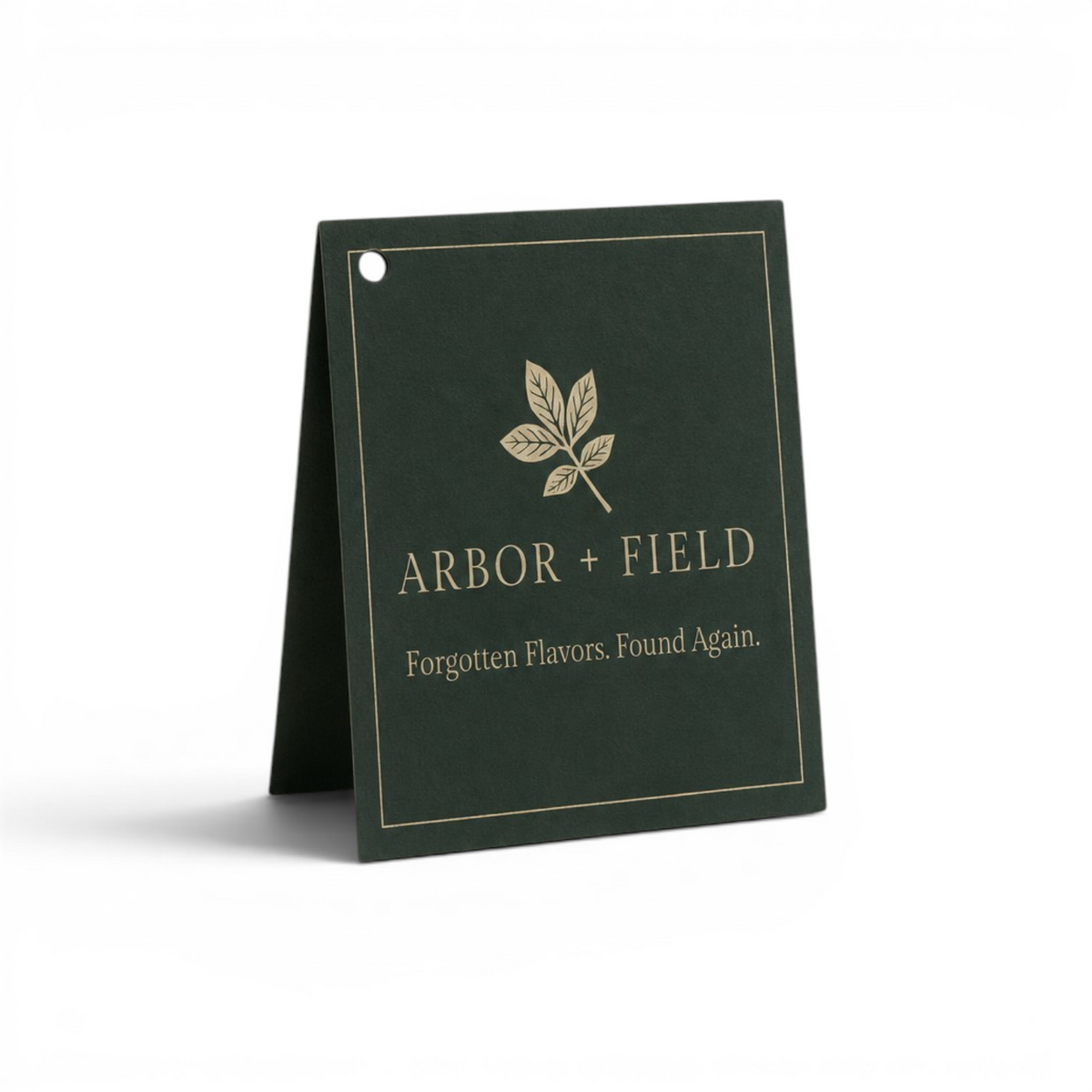 Dark green gift tag with cream 'Arbor and Field' logo with leaf emblem and "Forgotten Flavors. Found Again." tagline underneath. Clean white background, premium look and feel.