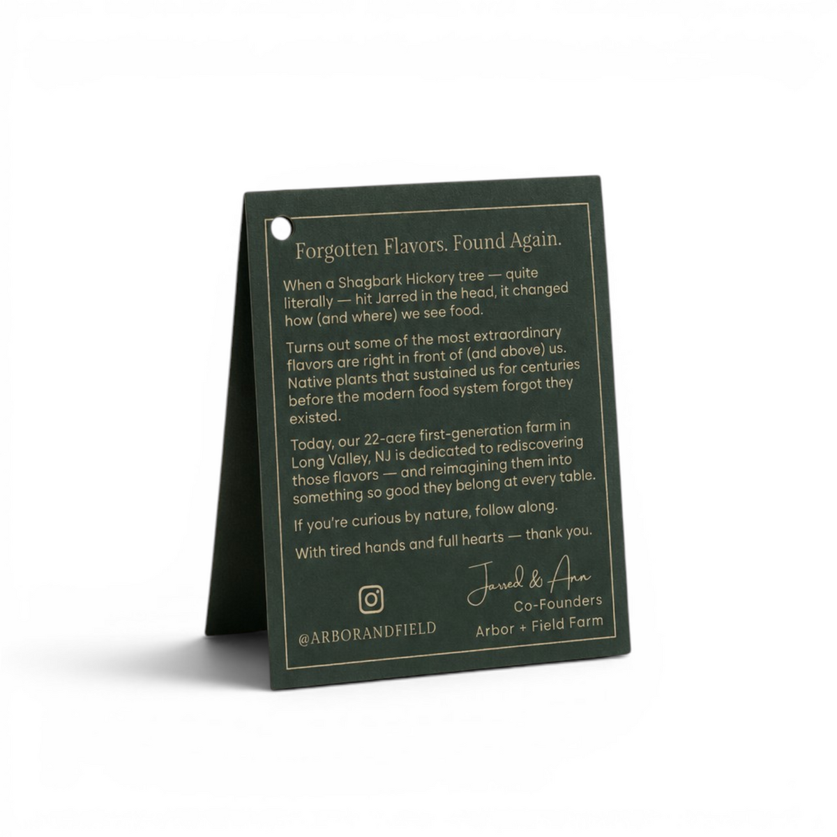 Back of a dark green gift tag with thank you note from co-founders of Arbor and Field in cream text. Clean white background, premium look and feel.